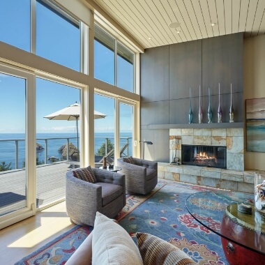 Real estate interior photo of living room with ocean view